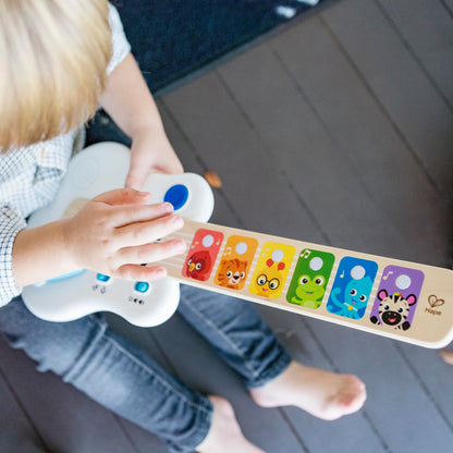HAPE Baby Einstein Magic Touch puidust mängukitarr heliefektide ja valgusega, 12+ kuud